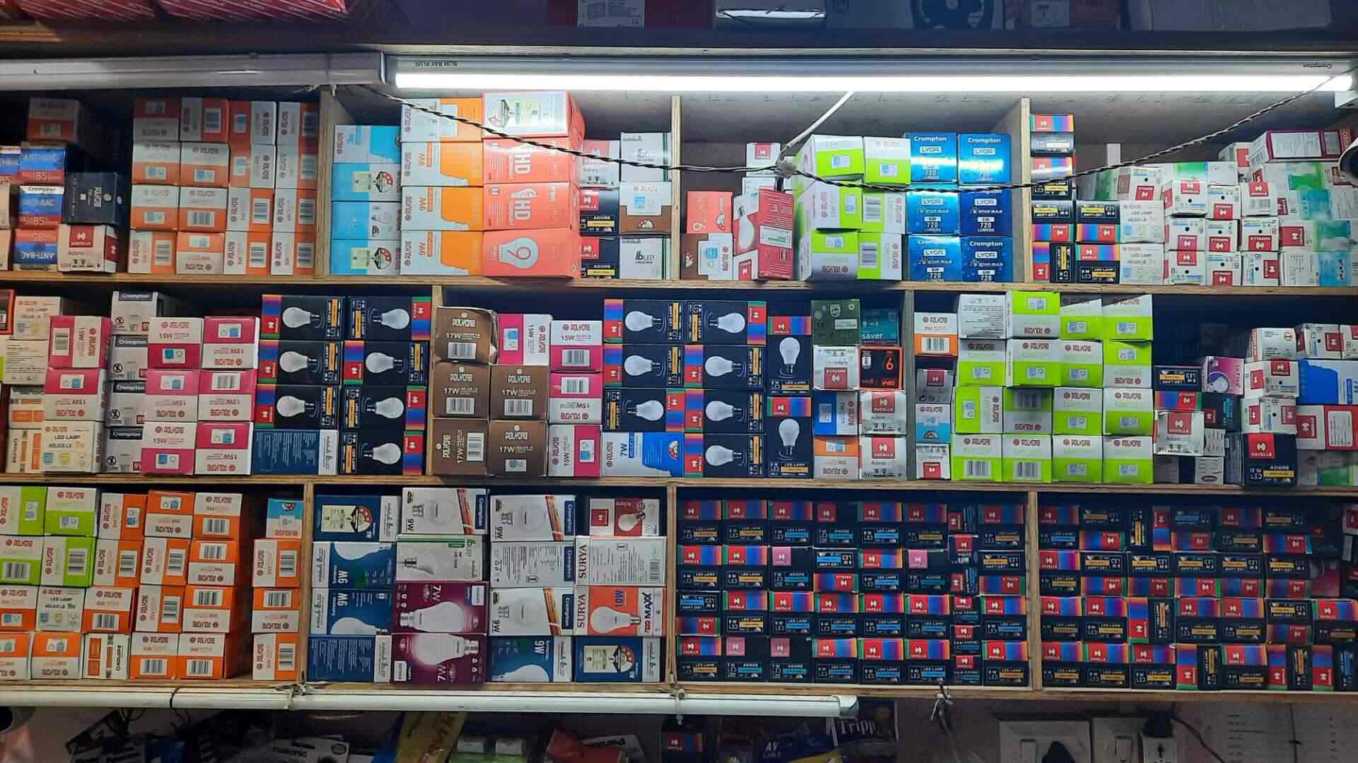 Boxed lighting products on shelves inside RRR Electricals
